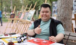 Down sendromlu Fatih kanserle mücadelenin zorluklarını sanatla aştı